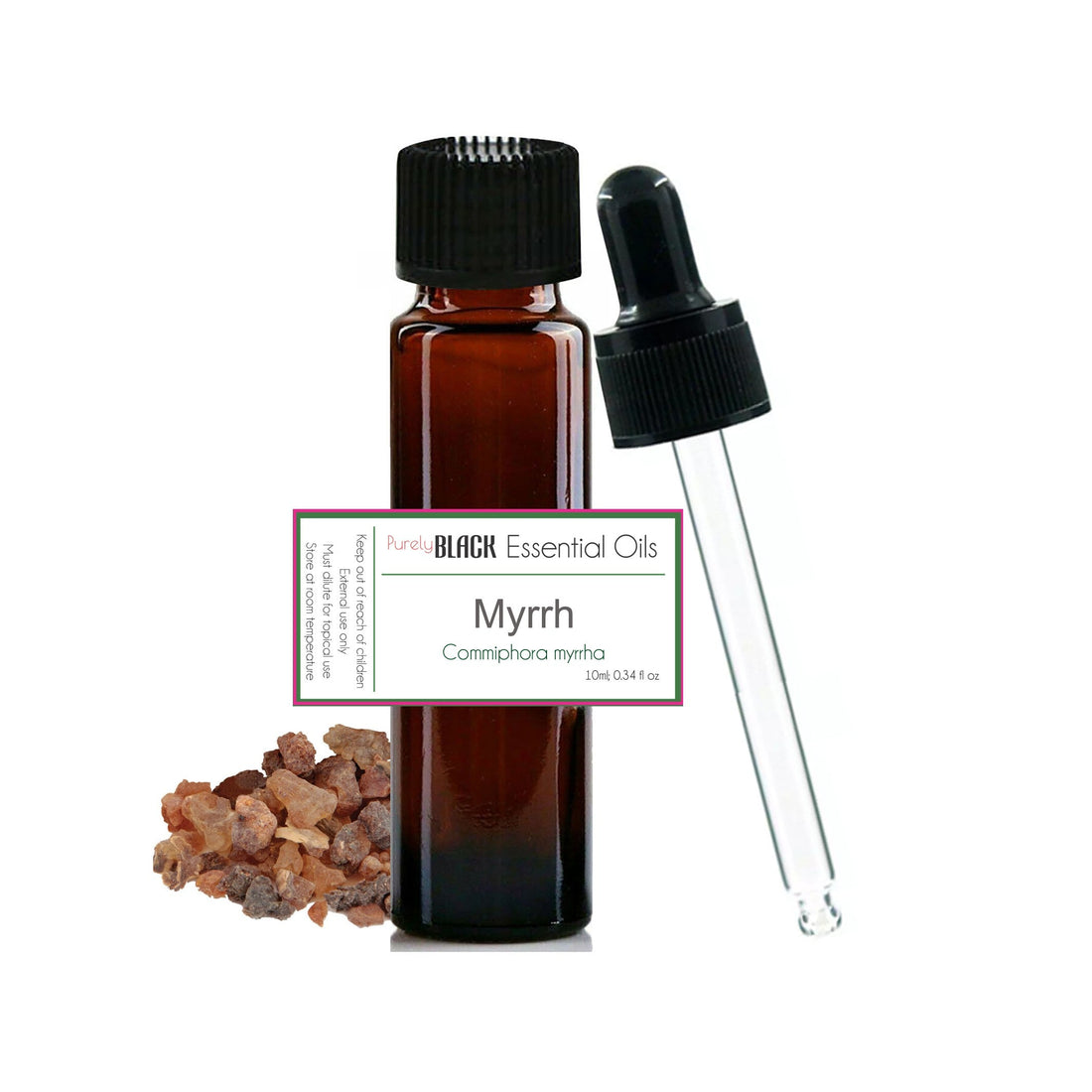 A bottle of PurelyBlack pure myrrh essential oil sitting on a wooden surface with raw myrrh resin pieces.