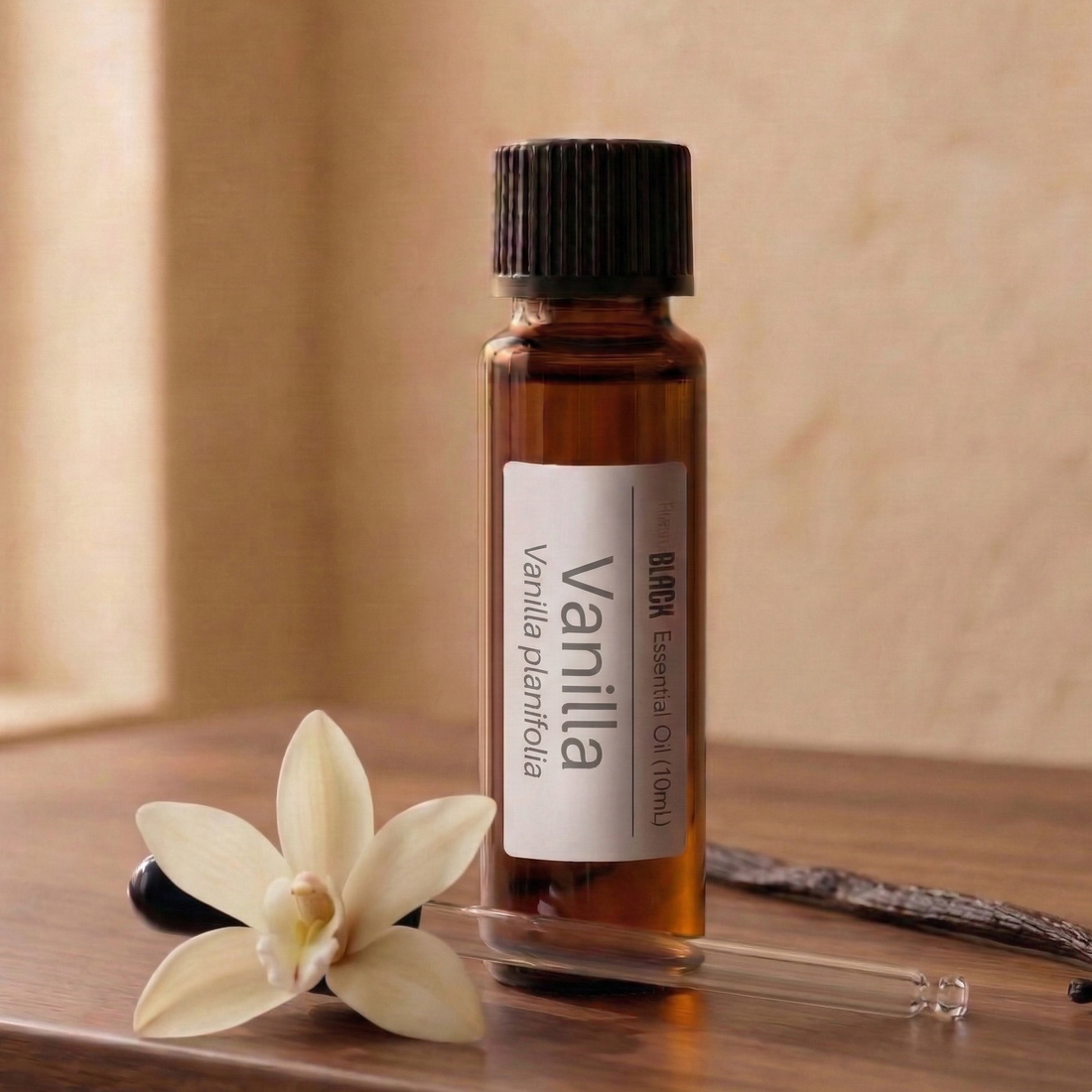 A 10ml bottle of purelyBlack pure Vanilla CO2 extract surrounded by natural vanilla beans, highlighting its use for hair growth and clean beauty perfumery.