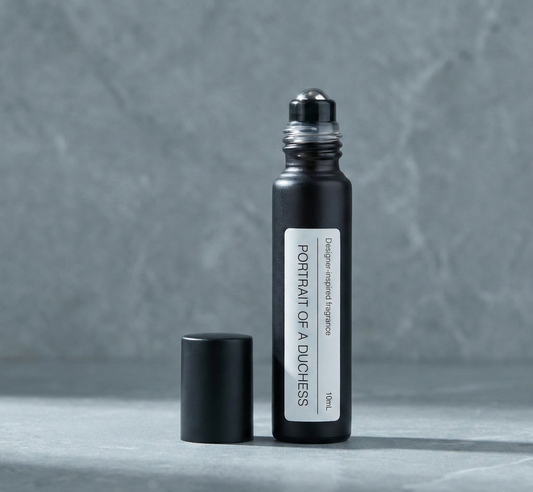 PurelyBlack Portrait of a Duchess perfume oil roller applied to a wrist for fragrance layering and creating a signature scent.