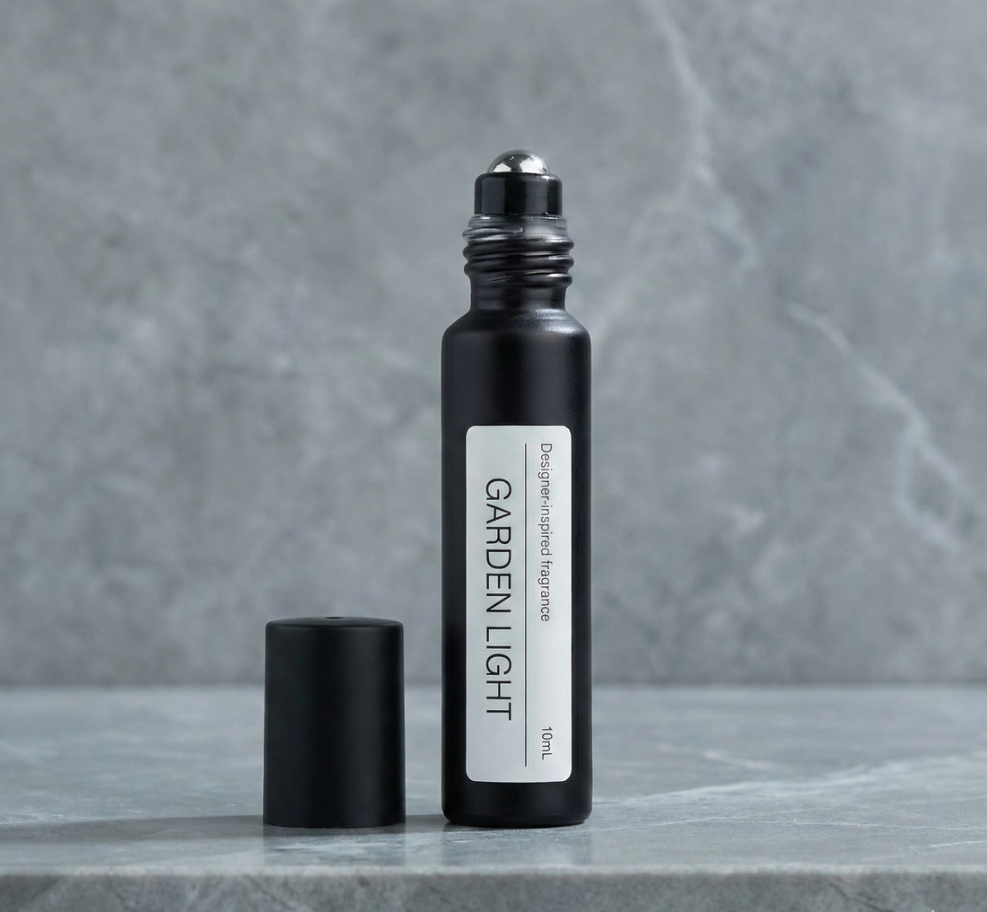 A bottle of the best alternative to Jo Malone Basil & Neroli surrounded by fresh green basil leaves and delicate white neroli blossoms
