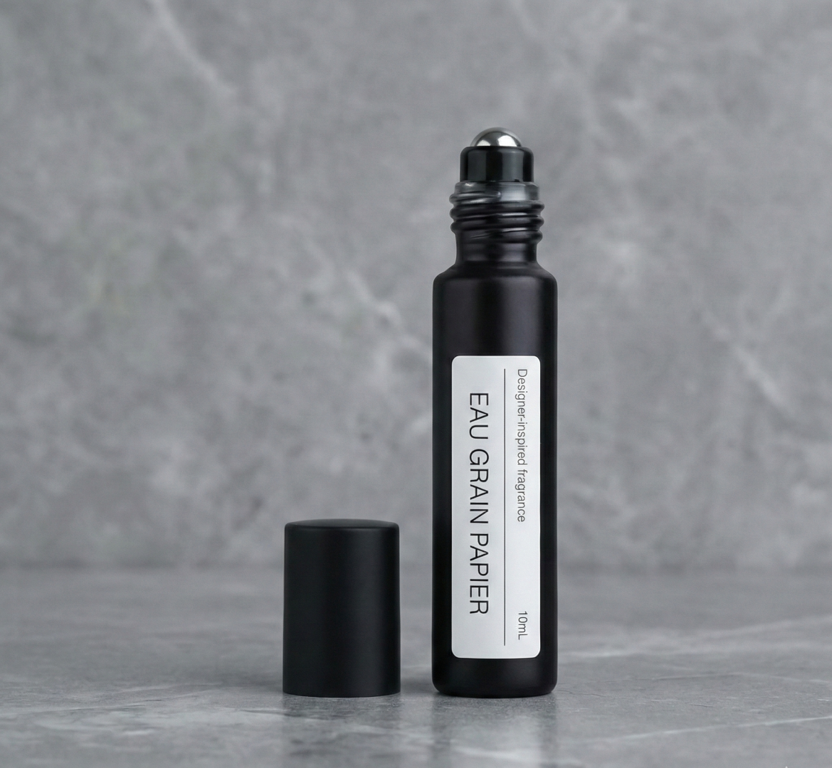 Black perfume spray with minimalist label EAU GRAIN PAPIER woody fragrance alternative