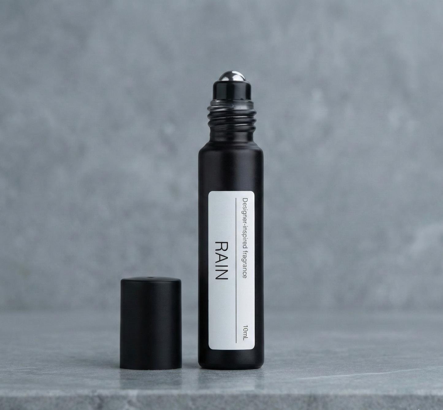 Glass spray bottle on white background RAIN alternative Marc Jacobs RAIN Splash